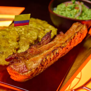 SMOKED CHICHARRON WITH GUACAMOLE AND TOSTONES